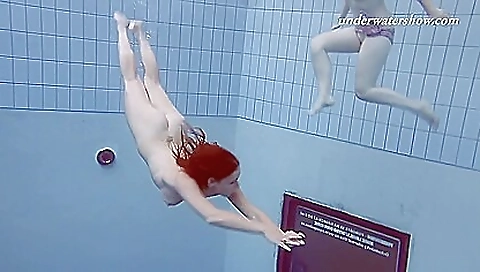 Two nude bitches in bikini underwater in the beach