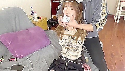 kinky asian brunette is getting fucked with a dick