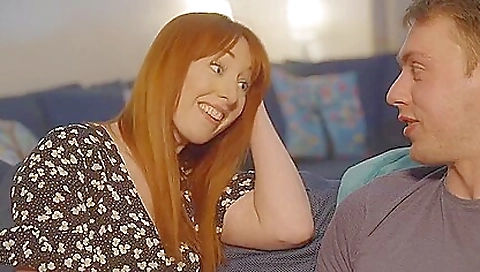 Redhead with a tattooed booty is fucking her big dick