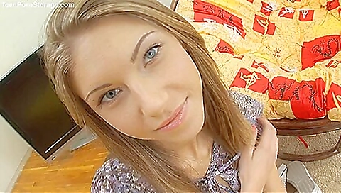 Shaved blonde teen is on top of a cock in the middle of action