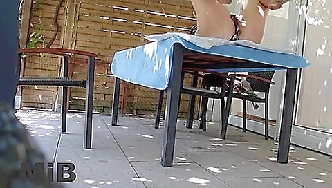 Bitch in a bikini wearing glasses and high heels shows her legs