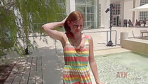 Sexy brunette with a hot body and feet play with hair