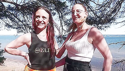 Hot couple having a threesome on the shore at the pond